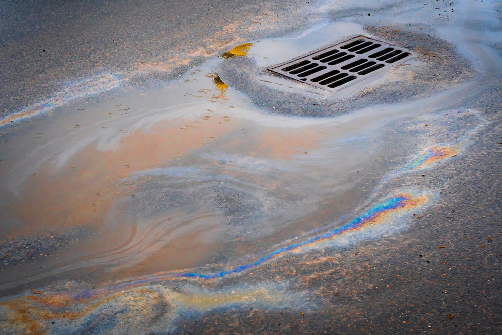 Clean Up Oil Spill On Asphalt.1693925225 
